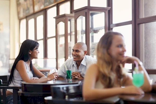 middle-aged man on a first date with a pretty woman at a pub during lunch.