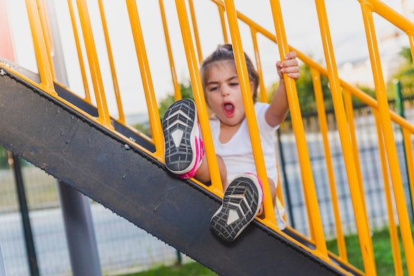 tired child yawning during playtime because lack of sleep